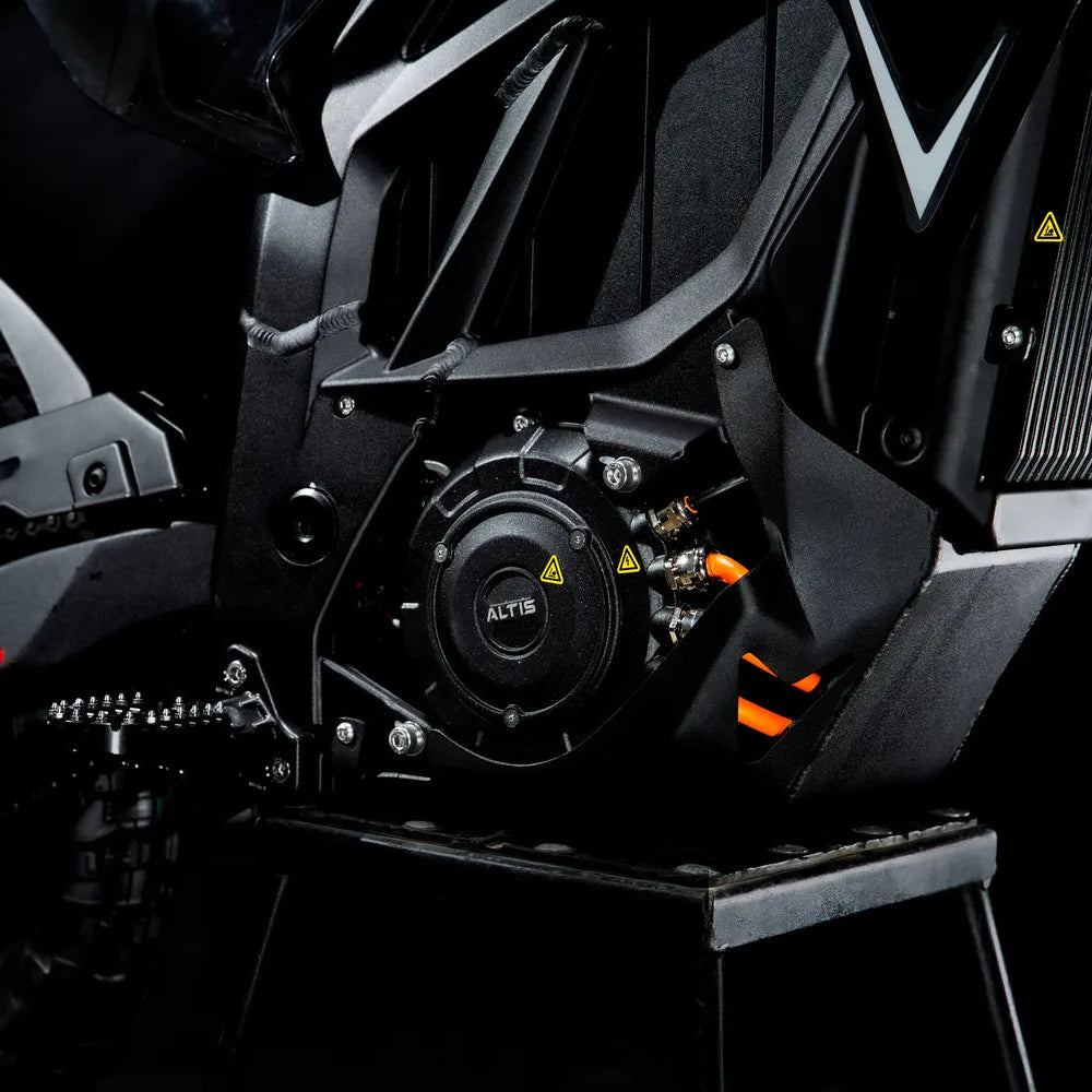 Close-up of the Altis-badged drive unit on the Sigma, with orange high-voltage cables and a serrated footpeg