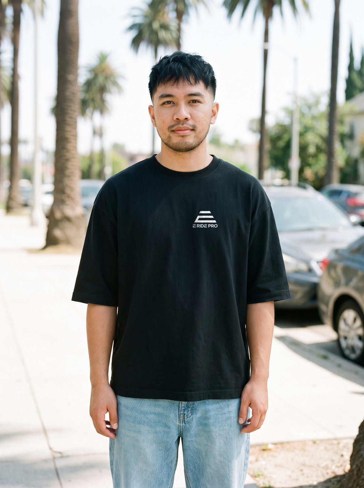 E Ride Pro Logo Tee in black worn by a man, E Ride Pro logo printed on the left chest