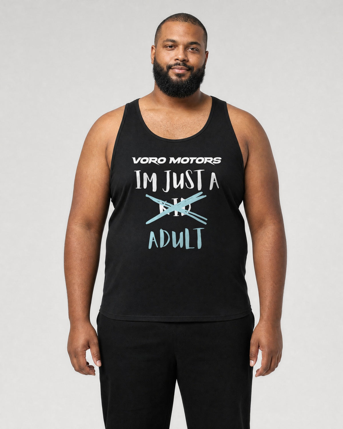 Bigger man wearing the I'm Just a Kid Adult tank in black