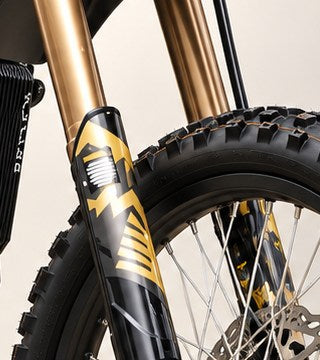 Surron Ultra Bee fork cover seen from the side showing the full guard