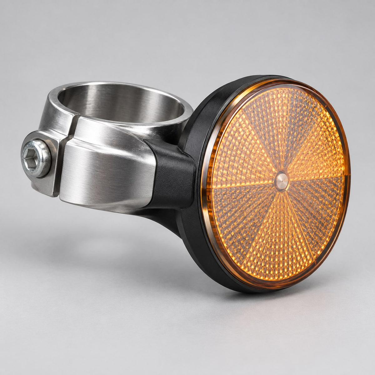 Suspension reflector for the Surron Ultra Bee, amber reflector on a fork clamp, studio product photo