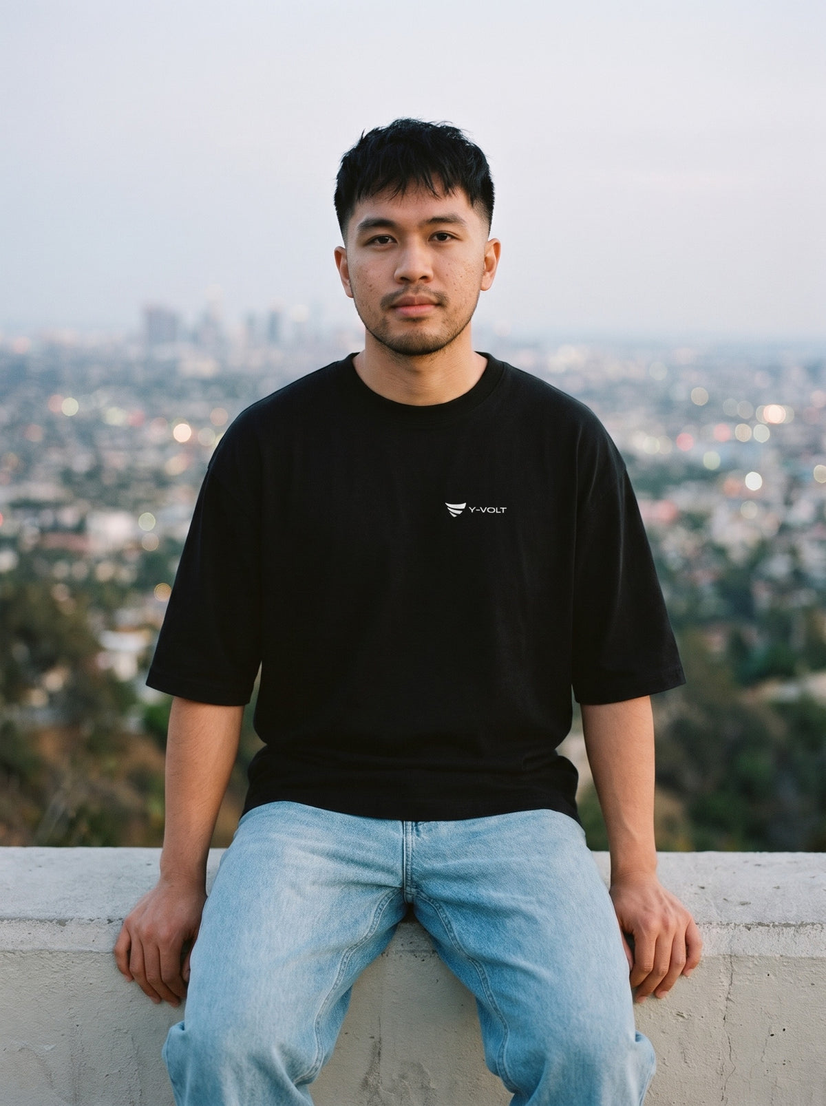 YVolt Logo Tee in black worn by a man, YVolt logo printed on the left chest