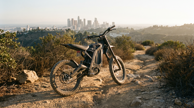 Electric dirt bike on a fire road above the Los Angeles skyline