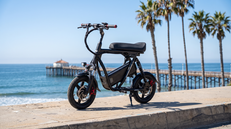VoroMotors seated electric scooter on the San Diego coast