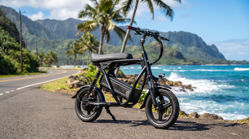 VoroMotors seated electric scooter on an Oahu coastal road