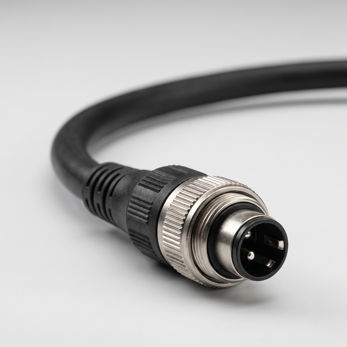 Close up of the three pin threaded output connector on the VM 1 charger cable
