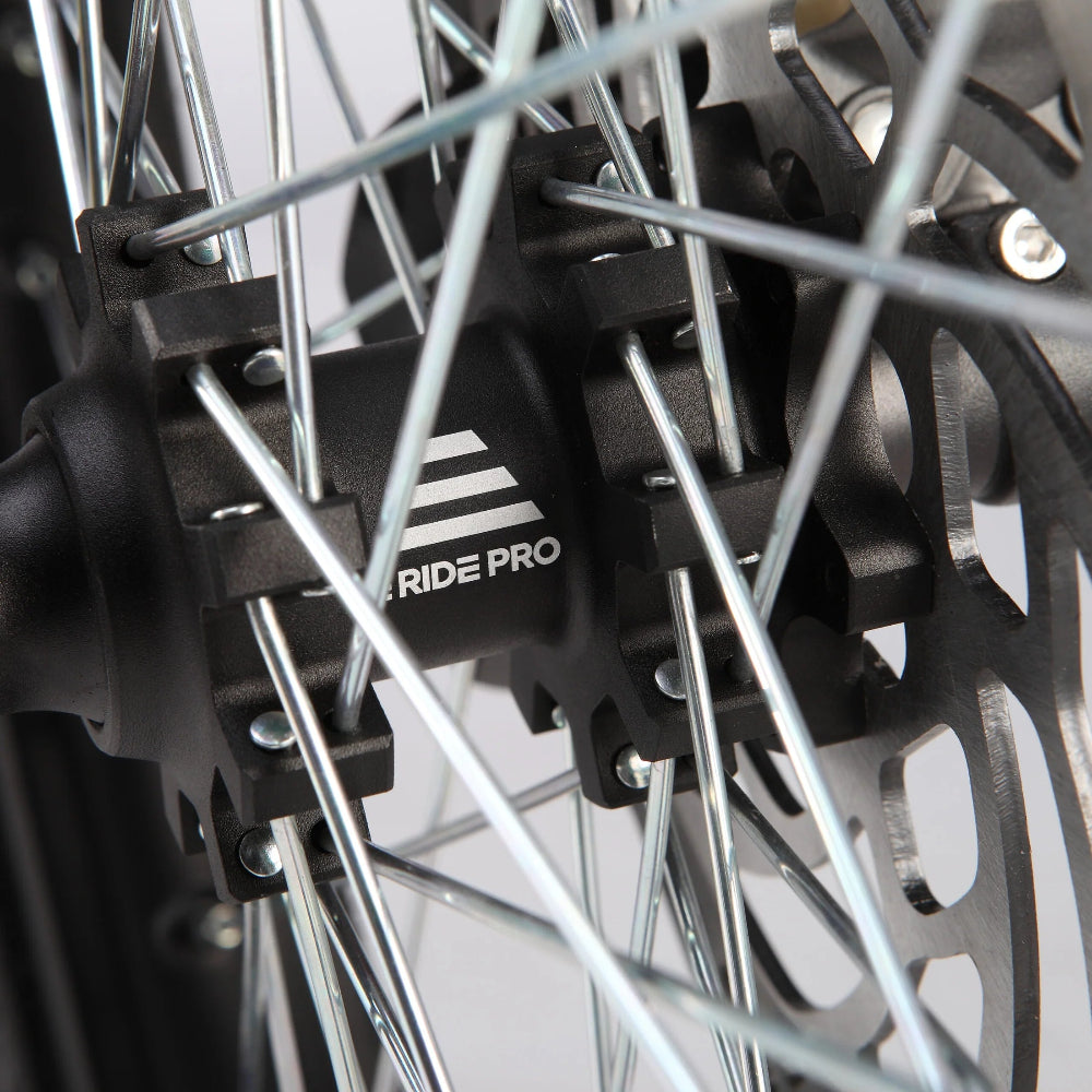 Spoked, full-size, dirt-bike proportions.