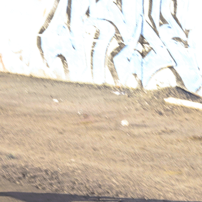 Gif or moving image of person riding Dualtron Storm Limited electric scooter on dirt pathway, video loops