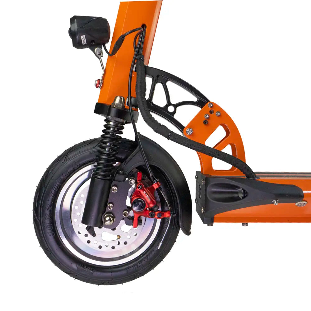 Two shocks between you and the asphalt. Potholes arrive already softened.