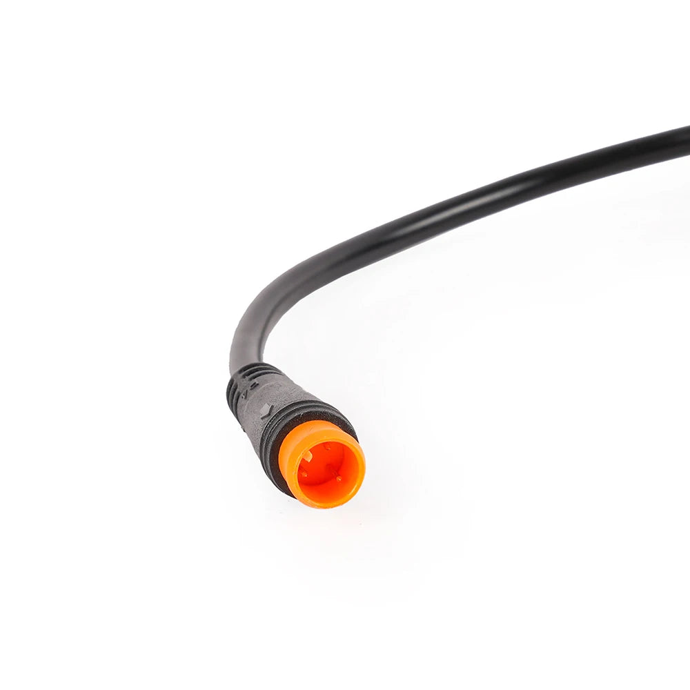 The connector adapter lead with its orange waterproof plug, shown end on so the pins are visible