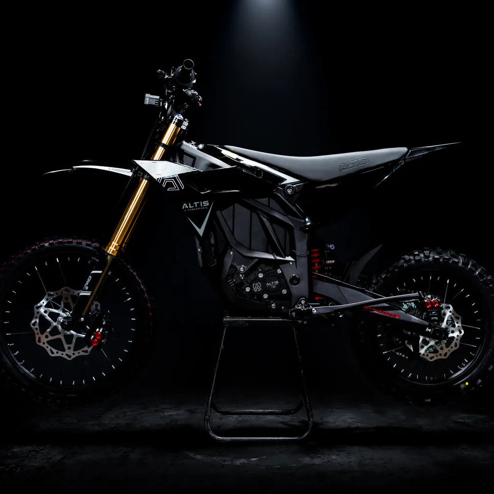 2027 Altis Sigma electric dirt bike in black, side profile facing left, on a stand in a dark studio