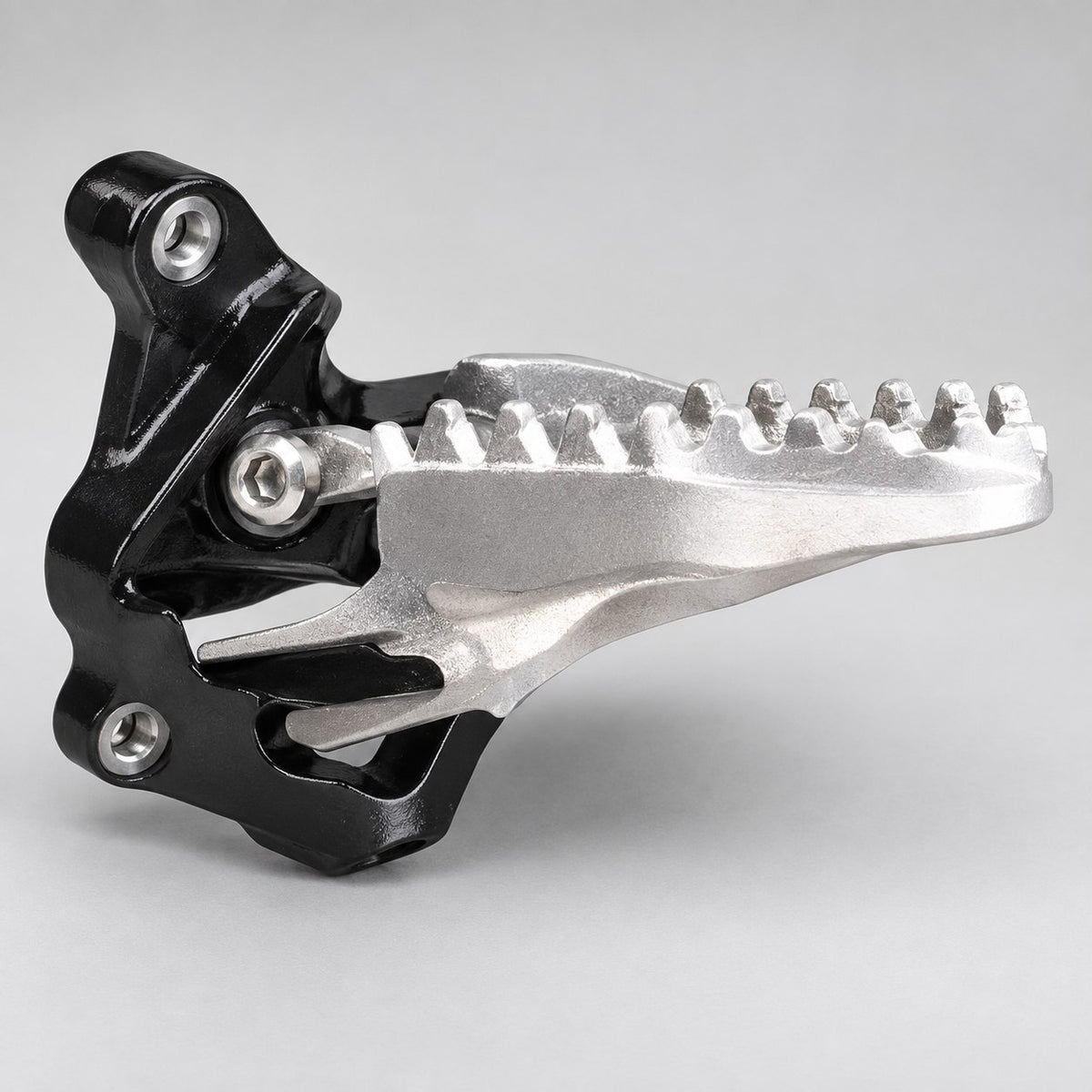 Foot peg with mount for the Surron Ultra Bee, serrated alloy platform on a black steel bracket