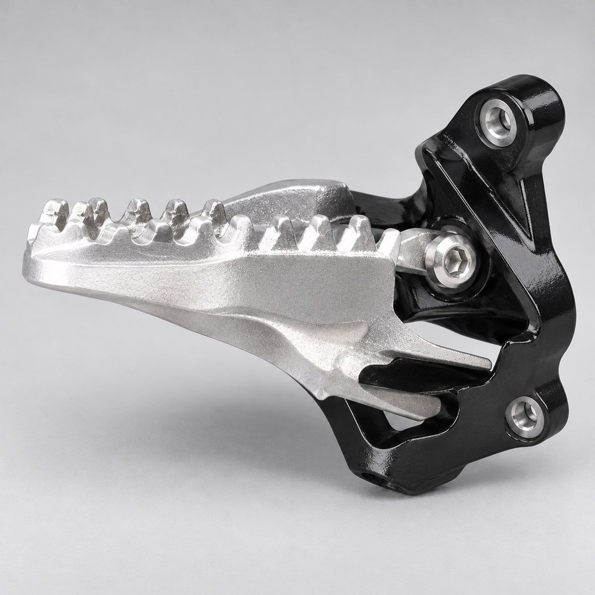 Underside view of the Surron Ultra Bee foot peg and mount bracket