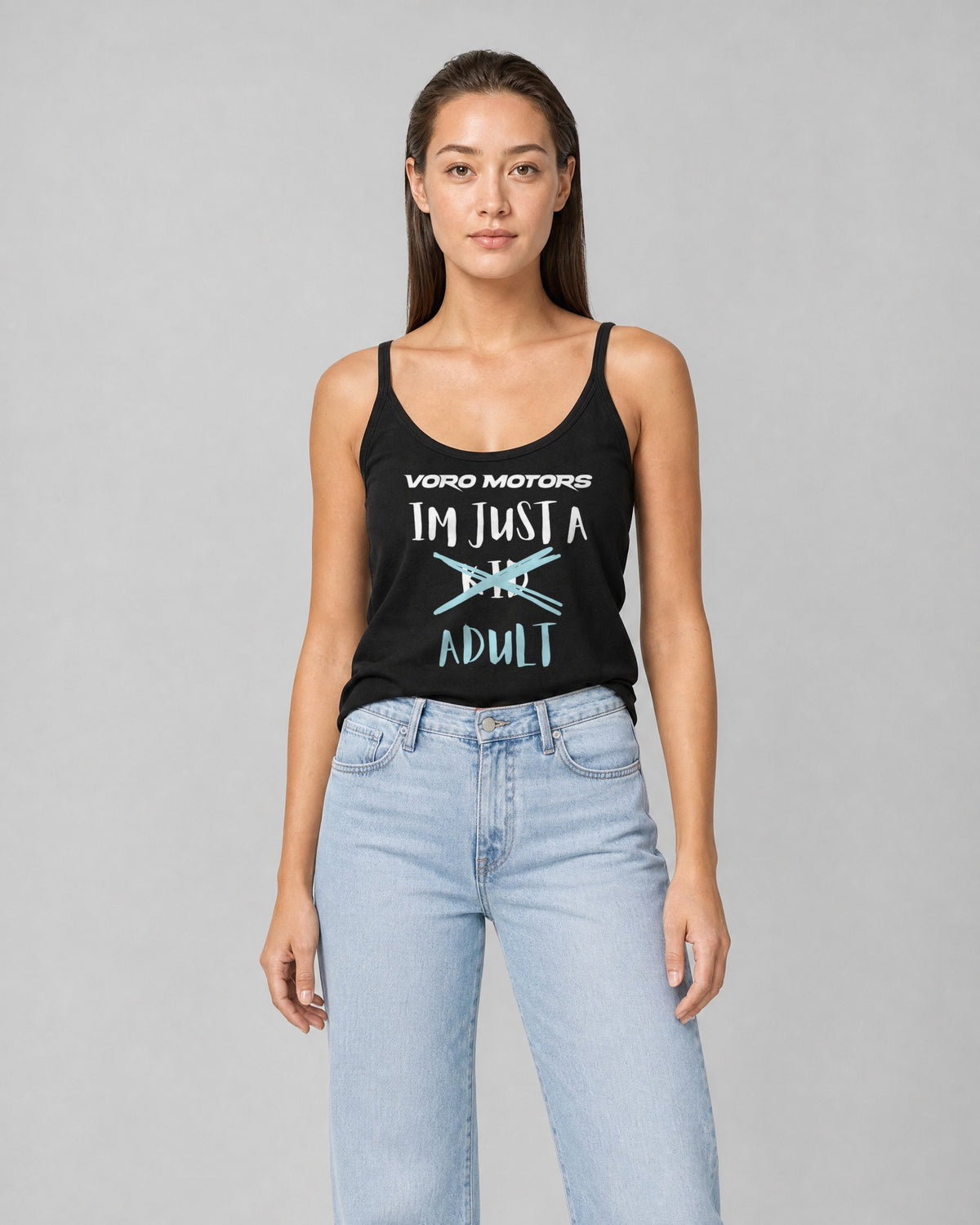 Woman wearing the I'm Just a Kid Adult tank in black