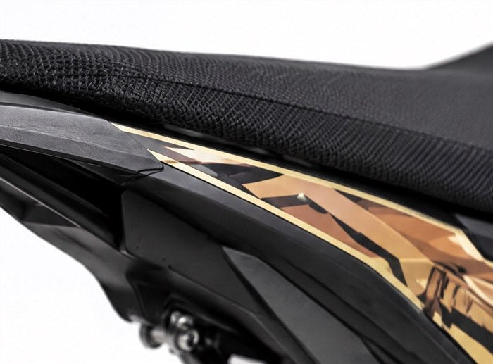 Rear section of the Surron Ultra Bee side fairing where it tapers under the seat