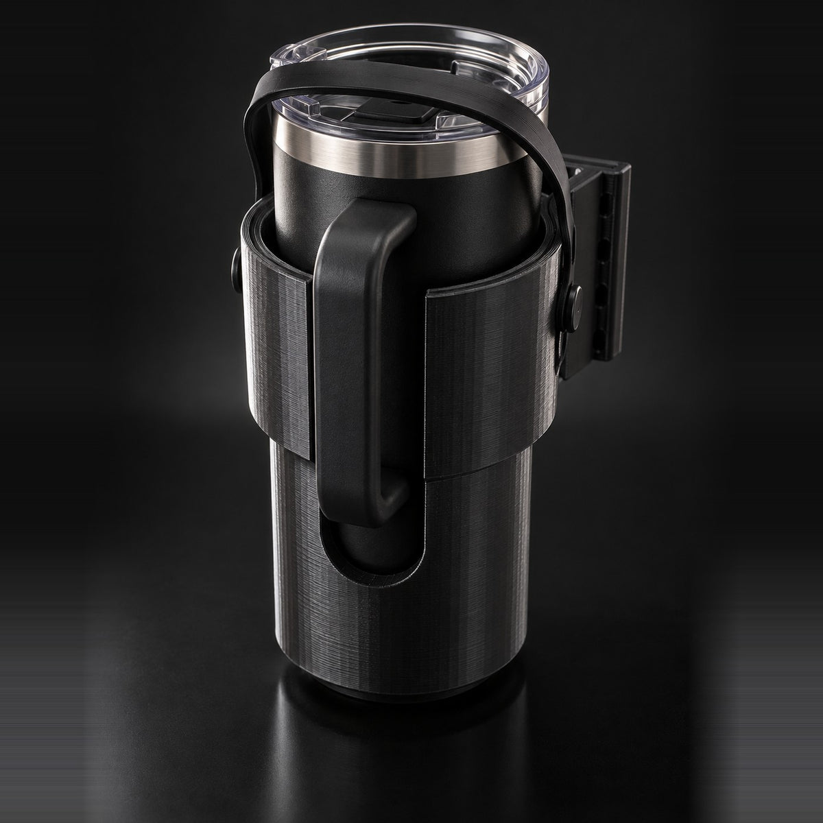 Tumbler seated in the holder, handle down the front slot, strap over the lid
