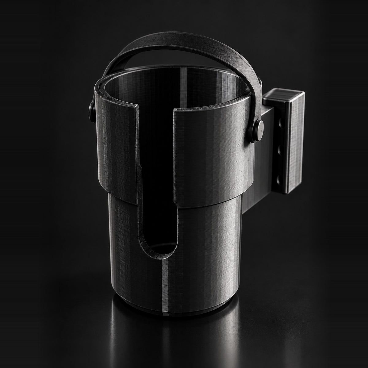 Black 3D-printed cup holder lit from the right