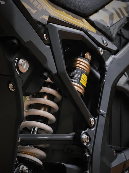 Close-up of the Surron Ultra Bee rear shock and linkage